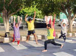 Participants perform yoga poses during Raahgiri Day celebrations