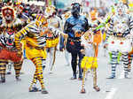Artists with their body painted as tiger dance
