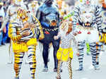 Artists with their body painted as tiger dance