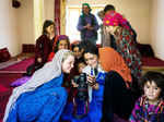 A group of Afghani women admiring photographs clicked