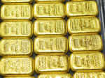 Gold slips in futures trade on global cues