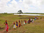 Devotees take water from Kalamba Lake