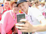 ​England cricketer Joe Root poses for a selfie with a fan