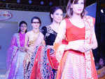 Models walk the ramp during Jaipur Couture Show
