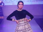 ​​A model walks the ramp during a fashion show