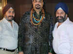 Designer duo Ravinder and Tejinder Singh pose with Qawwali singer