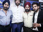 Designer duo Ravinder and Tejinder Singh pose with Rohan Rawat
