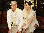 On Java, the bride and groom both sit on the lap