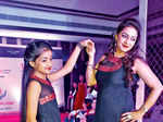 Ruchi walks the ramp with her daughter