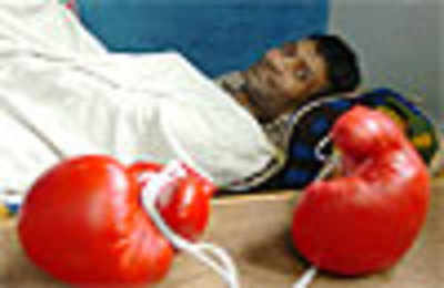 Paralysis shatters boxing coach's dreams