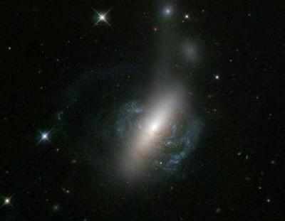 Brightest galaxy getting shredded by hungry black hole
