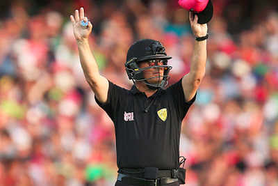 Once concussed, umpire John Ward wears helmet during ODI