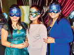 Socialites at masquerade party