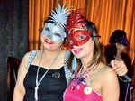 Socialites at masquerade party