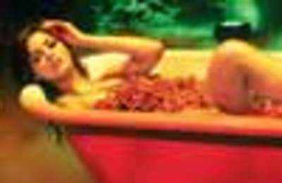 Neetu Chandra in a tub of red chillies!