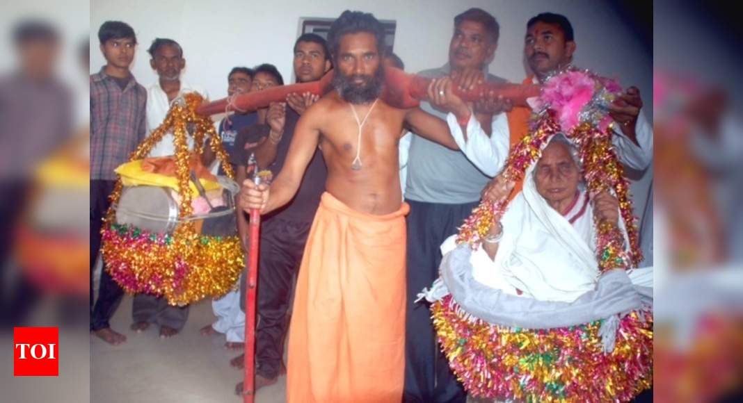 With blind mother on his shoulder, modern day's Shravan arrives in Agra |  Agra News - Times of India
