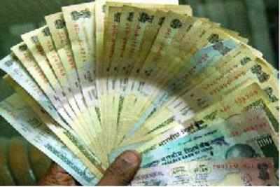 Rupee inches up 7 paise against dollar