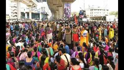 Slogging to keep home fires burning, women garment workers in a double bind