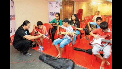Pen or guitar, kids shine on TOI centre stage