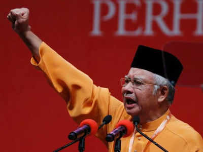 Malaysian government backs Islamic law, ethnic parties upset