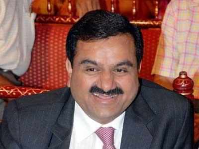 Adani eyes financial services, ties up with Macquarie for NBFC