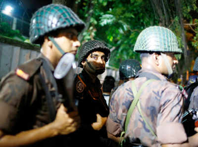 Shooting in Dhaka's diplomatic zone, many foreigners believed to be taken hostage