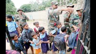Students, parents stand off against Army to save school