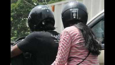 Helmet rule good, execution tough task