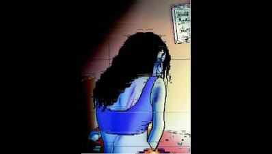 Man held for raping woman in front of her son