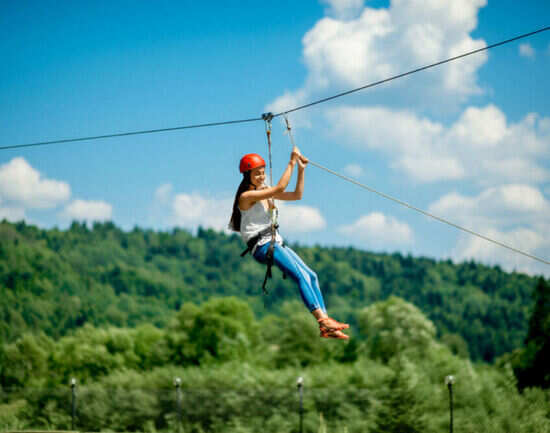 Jump through the trees and fly on a zip line