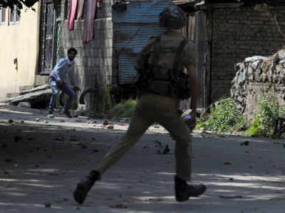 Protesters defy curfew in Kashmir, 50 hurt in clashes