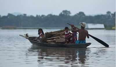 Floods spread, bring India to its knees