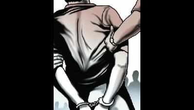 Four cops, boxer held for helping gangster escape
