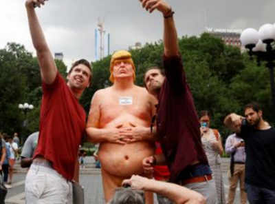 Naked Trump statues draw dozens of onlookers in US cities