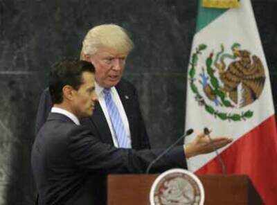 In Mexico, Donald Trump defends border wall