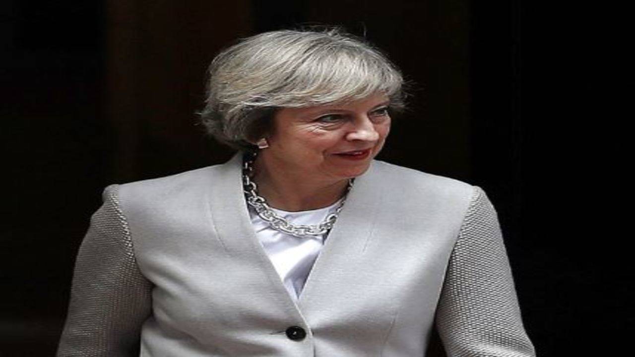 UK PM Theresa May urged to replace signature heels with flats – Times of India