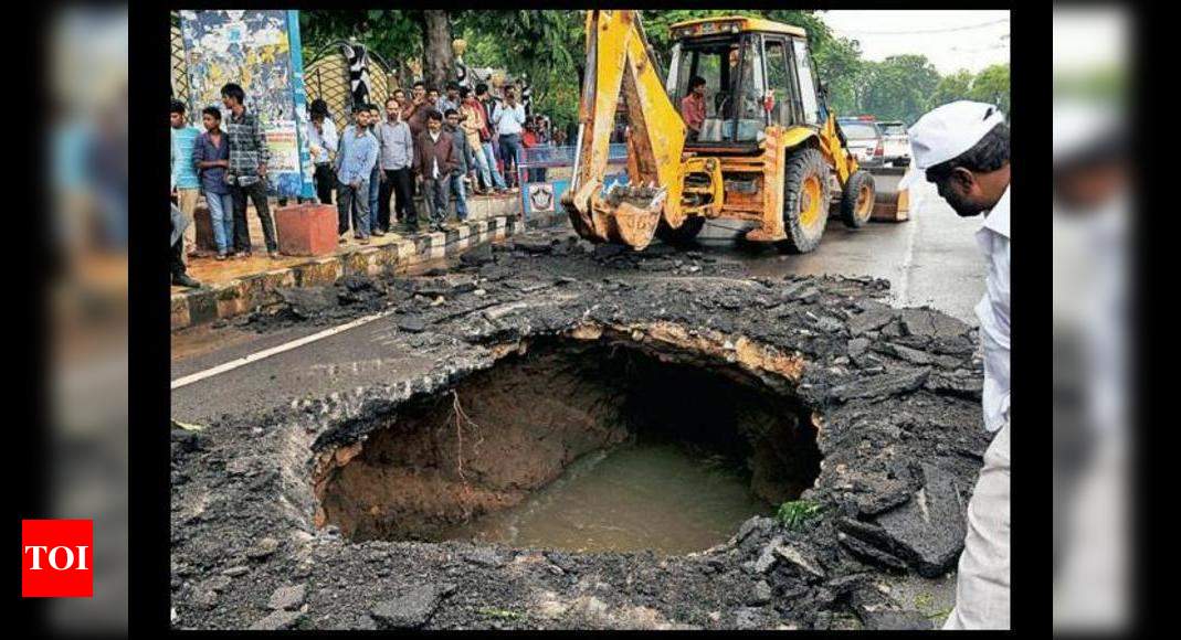 Hyderabad Rain: Sinkhole hits traffic on Necklace road | Hyderabad News ...