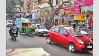 <p>Parked cars eat up road space</p>