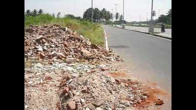 Roads turn dumping yards for construction debris