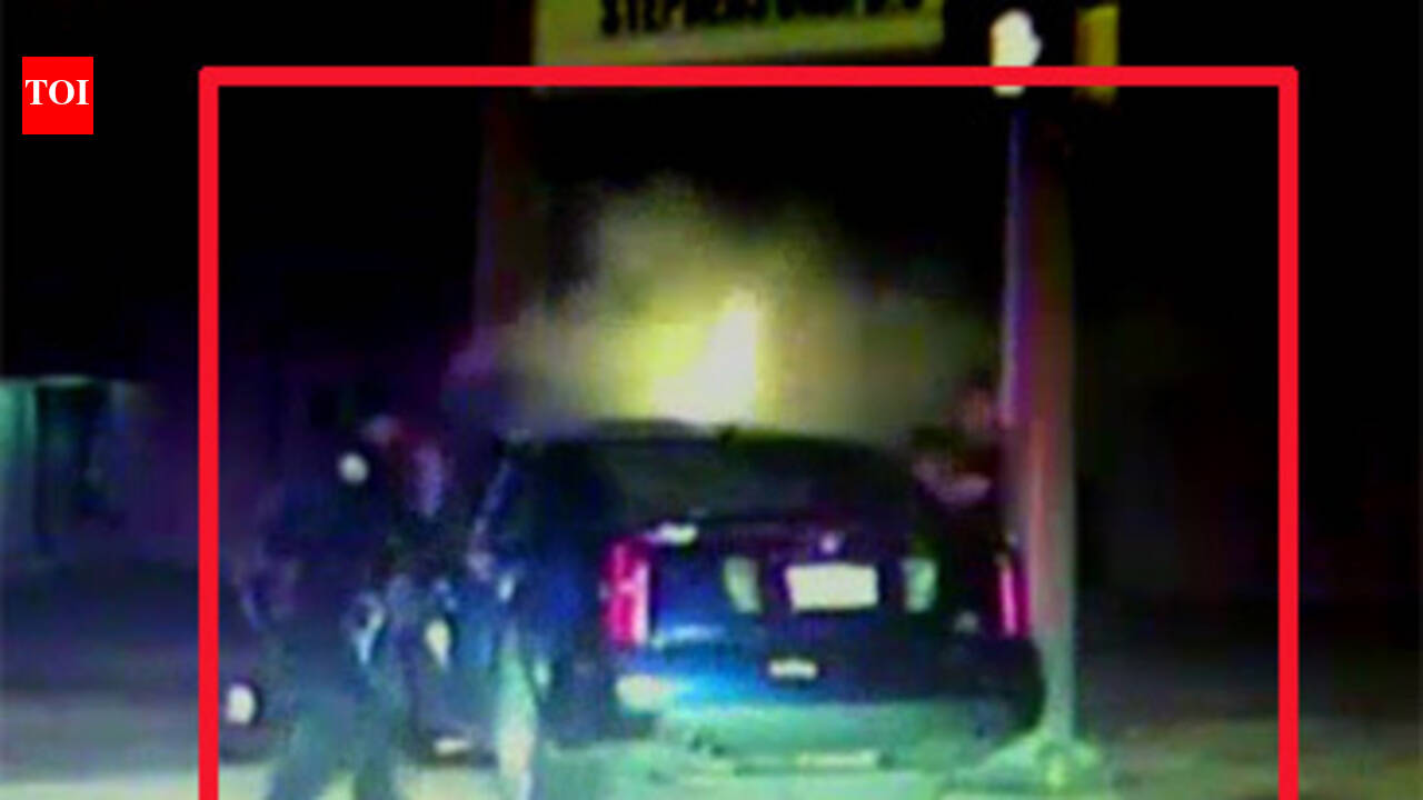 Caught on camera: Cops rescue two from burning car