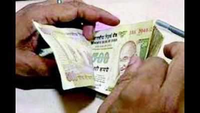 Two bankers booked for illegal exchange of demonetized cash