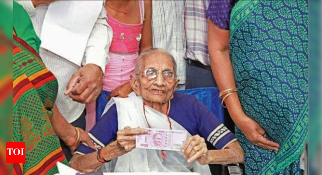 Modi'S Mother: PM’s mom queues up to change notes | Ahmedabad News ...