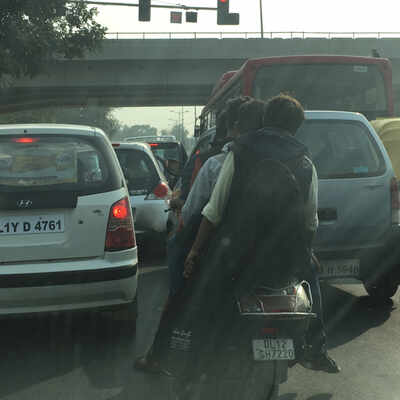 Four helmetless riders on a two-wheeler - Times of India