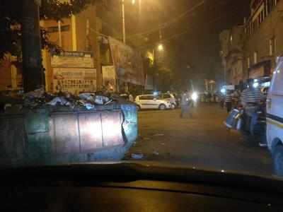 Garbage bin blocks road, traffic