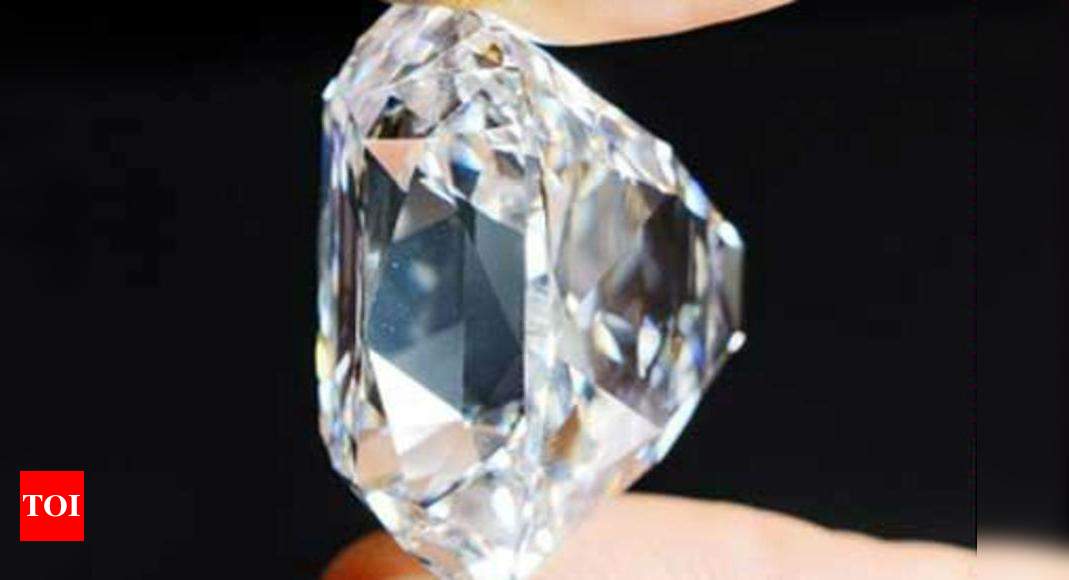 Polished diamonds with De Beers Group Industry Services grading