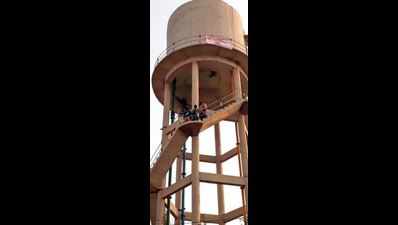 Now 3 jobless physical training instructors's climb water tank in Jalalabad