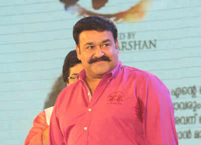 Mohanlal shimmered in a pink shirt at Oppam's 101 day celebrations