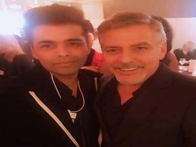 Karan Johar poses with George Clooney at World Economic Forum