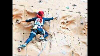 Stephen's students scale the wall with gusto at hiking championship