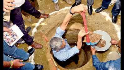 Scooping out stigma: Bureaucrat cleans toilet pit in Warangal village